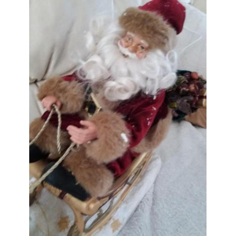 Kerstman in arreslee met muziek en bewegend 10 euro