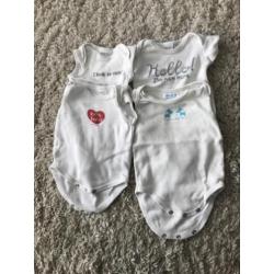 Vier witte rompers